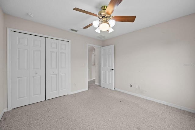 5339 Pond Crossing Pl, Leesburg, FL 34748 - unfurnished bedroom with carpet, a closet, and a ceiling fan