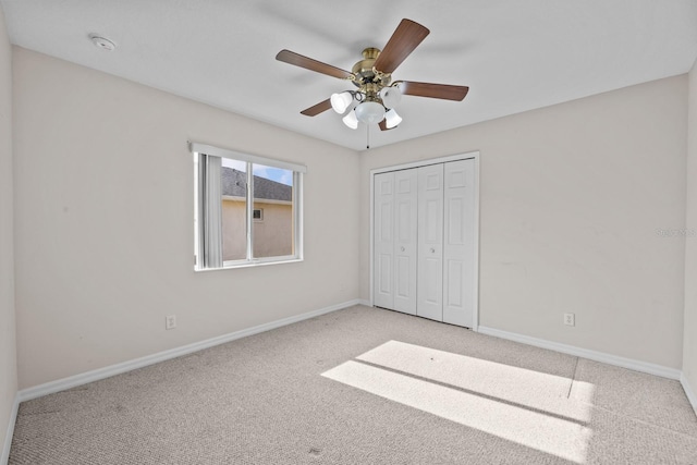 5339 Pond Crossing Pl, Leesburg, FL 34748 - unfurnished bedroom featuring carpet flooring, a closet, and a ceiling fan