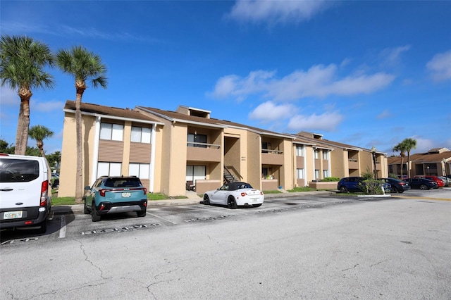 5027 Vineland Rd Unit 5027, Orlando, FL 32811 - view of property with uncovered parking and a residential view