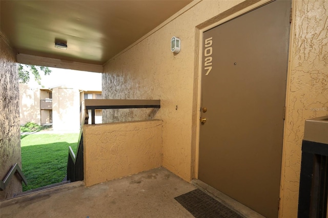 5027 Vineland Rd Unit 5027, Orlando, FL 32811 - doorway to property with stucco siding and a lawn