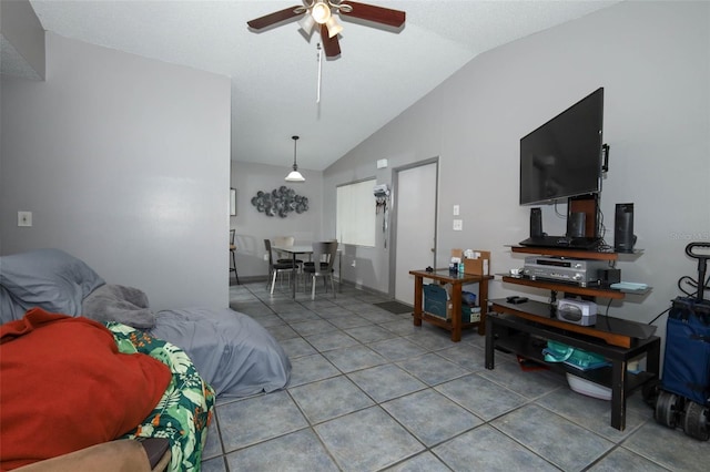 5027 Vineland Rd Unit 5027, Orlando, FL 32811 - tiled living area with vaulted ceiling and a ceiling fan