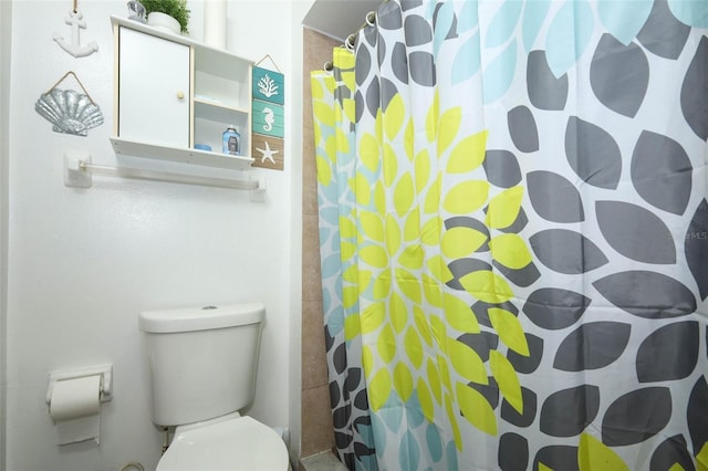 5027 Vineland Rd Unit 5027, Orlando, FL 32811 - bathroom featuring toilet and a shower with shower curtain