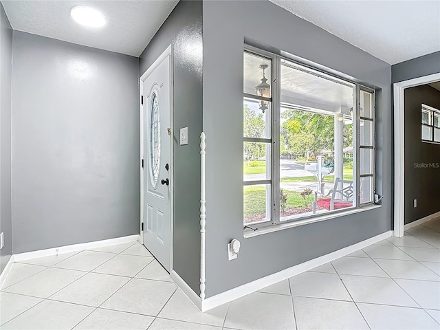 3417 Pershing Ave, Orlando, FL 32812 - foyer entrance with light tile patterned flooring and baseboards