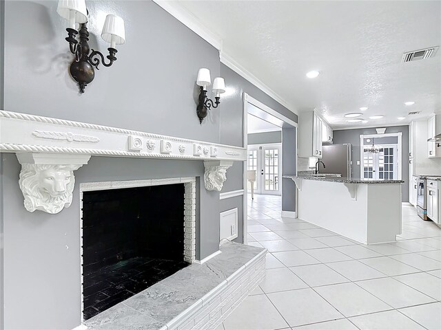 3417 Pershing Ave, Orlando, FL 32812 - detailed view of appliances with stainless steel finishes, ornamental molding, and recessed lighting