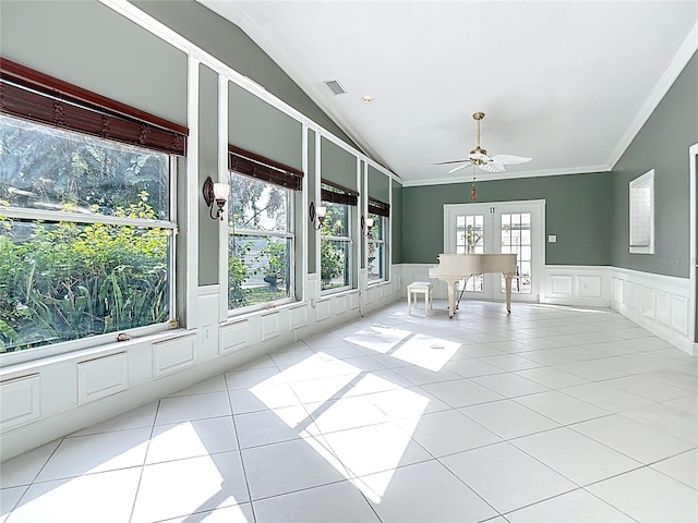 3417 Pershing Ave, Orlando, FL 32812 - tiled spare room with lofted ceiling, a decorative wall, wainscoting, ceiling fan, and crown molding