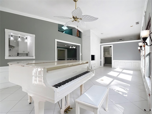 3417 Pershing Ave, Orlando, FL 32812 - unfurnished living room with tile patterned floors, ceiling fan, a wainscoted wall, a decorative wall, and ornamental molding