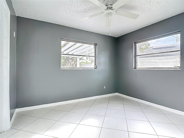 3417 Pershing Ave, Orlando, FL 32812 - tiled spare room with a textured ceiling and ceiling fan