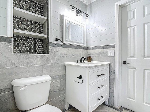 3417 Pershing Ave, Orlando, FL 32812 - bathroom with tile walls, vanity, and ornamental molding