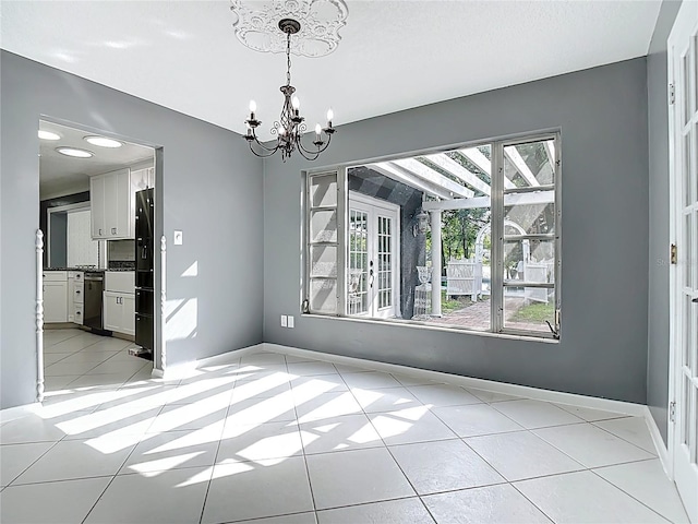 3417 Pershing Ave, Orlando, FL 32812 - unfurnished dining area with a chandelier and light tile patterned flooring