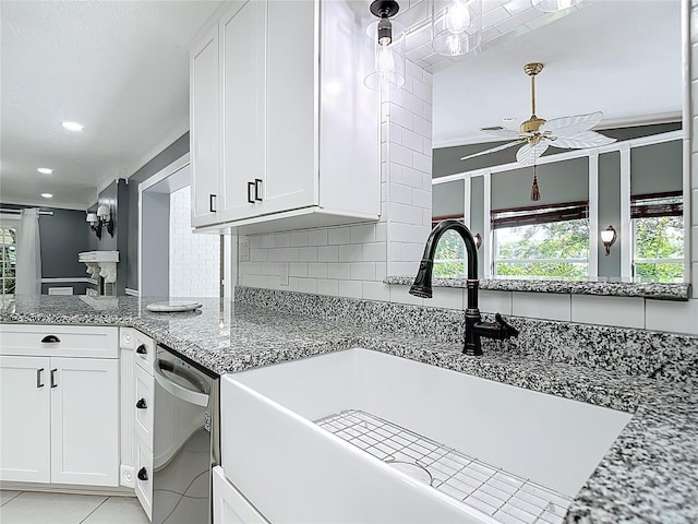3417 Pershing Ave, Orlando, FL 32812 - kitchen with ceiling fan, stainless steel dishwasher, white cabinets, light stone counters, and recessed lighting