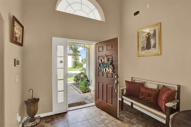 501 Lake Cummings Way, Lake Alfred, FL 33850 - foyer with a high ceiling and tile patterned flooring