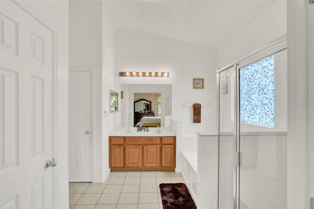 501 Lake Cummings Way, Lake Alfred, FL 33850 - full bath featuring a bath, tile patterned floors, lofted ceiling, a stall shower, and double vanity