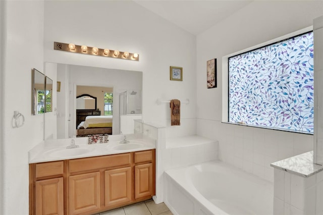 501 Lake Cummings Way, Lake Alfred, FL 33850 - full bath with a bath, double vanity, ensuite bathroom, and tile patterned floors