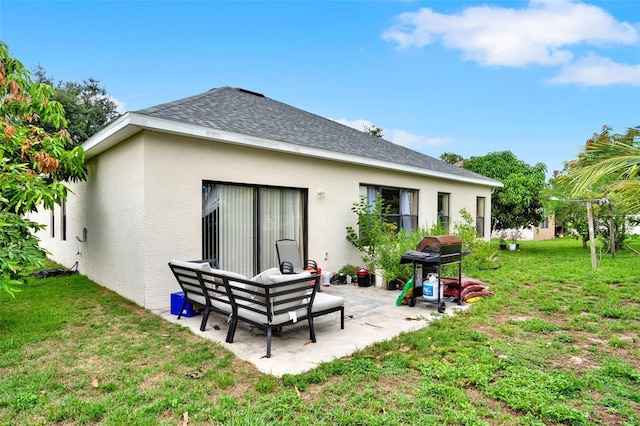 501 Lake Cummings Way, Lake Alfred, FL 33850 - rear view of house with stucco siding, a patio, a yard, and roof with shingles