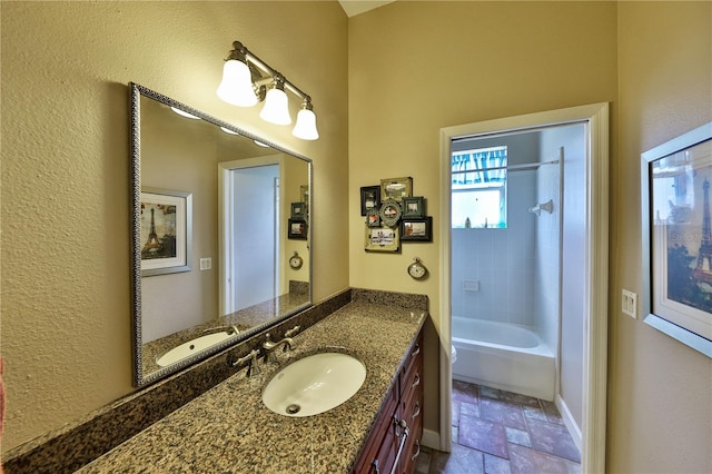 604 Timberwilde Ct, Winter Springs, FL 32708 - full bath featuring stone tile flooring, vanity, and tub / shower combination