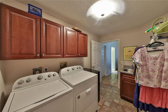 604 Timberwilde Ct, Winter Springs, FL 32708 - laundry area with separate washer and dryer, cabinet space, stone finish floors, and a textured ceiling