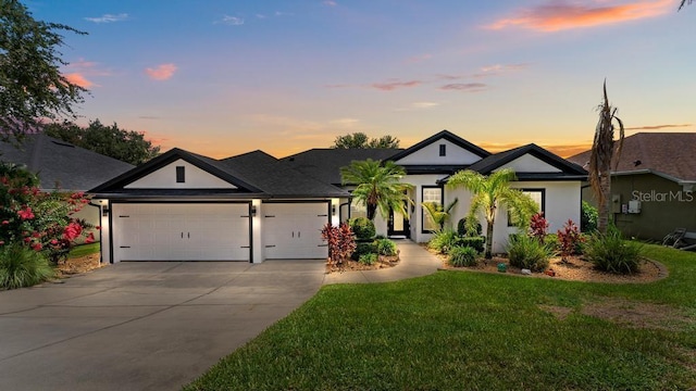 533 Quail Down Dr, Debary, FL 32713 - view of front of home featuring an attached garage, concrete driveway, a yard, and stucco siding