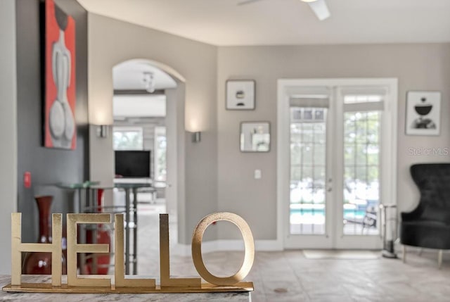 533 Quail Down Dr, Debary, FL 32713 - living room featuring arched walkways, french doors, and ceiling fan