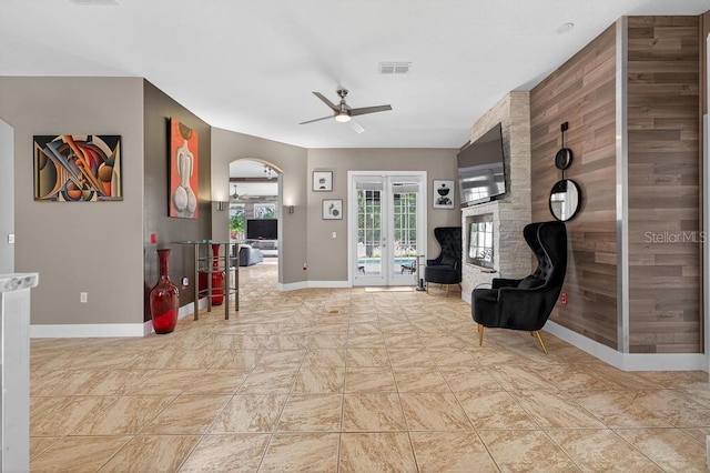 533 Quail Down Dr, Debary, FL 32713 - sitting room featuring a ceiling fan, french doors, and arched walkways