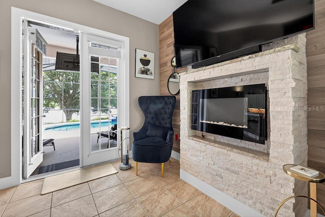 533 Quail Down Dr, Debary, FL 32713 - sitting room featuring a stone fireplace and tile patterned flooring