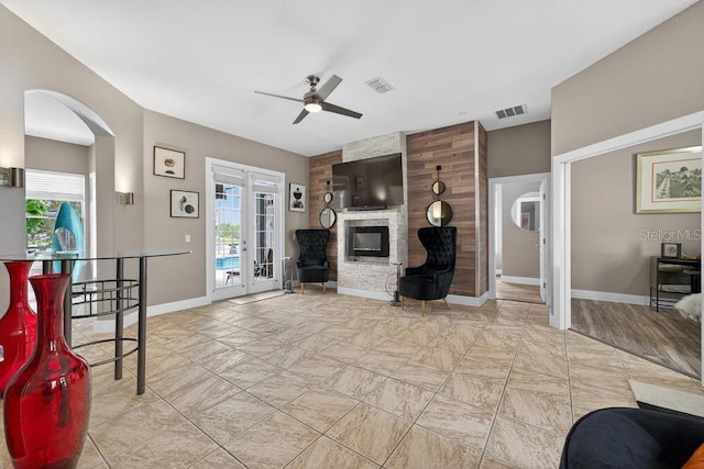 533 Quail Down Dr, Debary, FL 32713 - living room featuring ceiling fan, french doors, healthy amount of natural light, and arched walkways