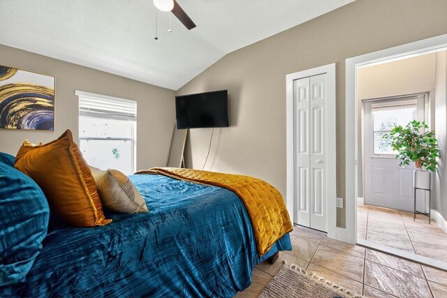 533 Quail Down Dr, Debary, FL 32713 - bedroom featuring vaulted ceiling, multiple windows, a closet, and a ceiling fan