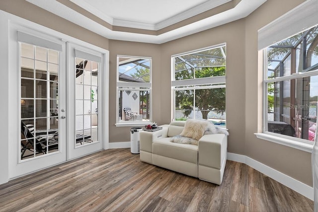 533 Quail Down Dr, Debary, FL 32713 - living area with crown molding, wood finished floors, healthy amount of natural light, and french doors