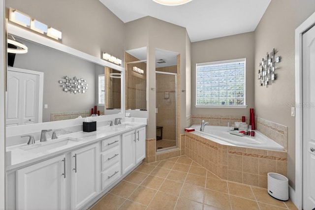 533 Quail Down Dr, Debary, FL 32713 - bathroom with a shower stall, a garden tub, tile patterned floors, and double vanity