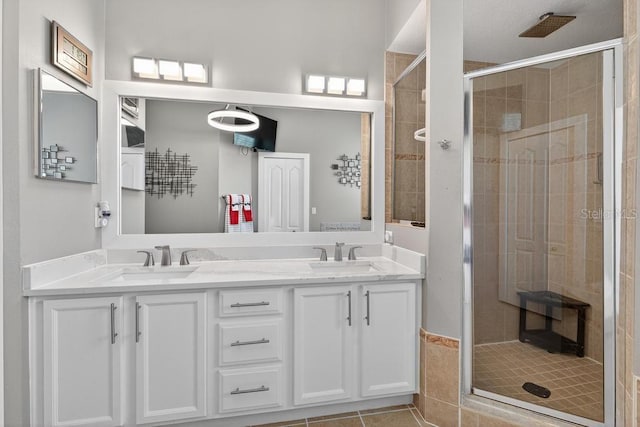 533 Quail Down Dr, Debary, FL 32713 - bathroom with a stall shower, double vanity, and tile patterned floors