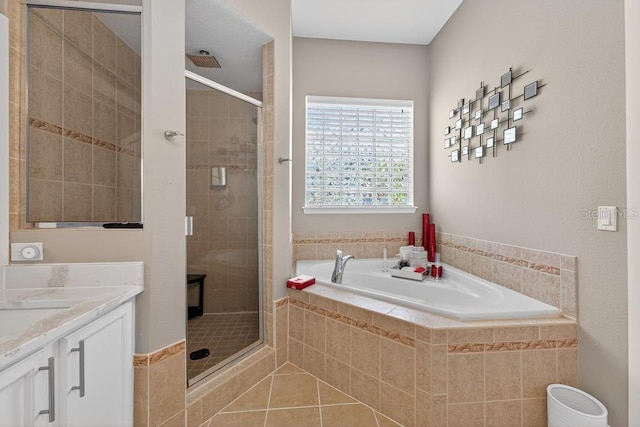 533 Quail Down Dr, Debary, FL 32713 - full bathroom with a bath, a shower stall, vanity, and tile patterned flooring