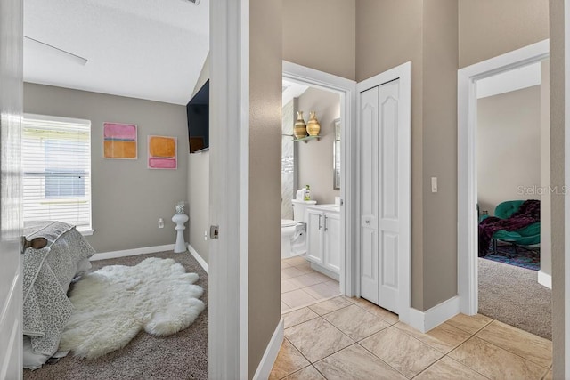 533 Quail Down Dr, Debary, FL 32713 - hallway featuring light colored carpet and light tile patterned floors