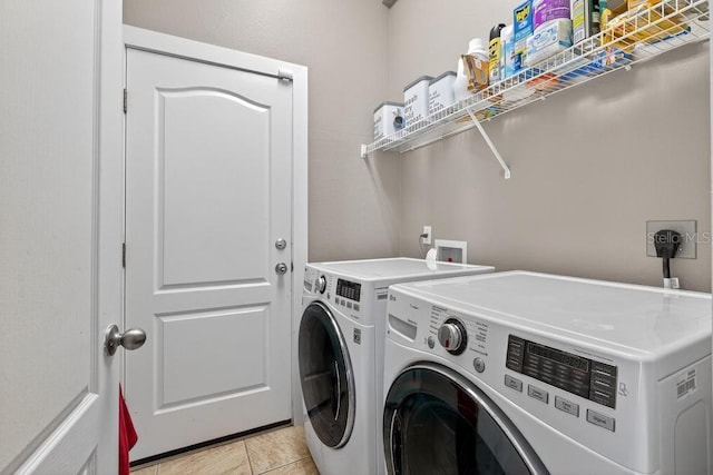 533 Quail Down Dr, Debary, FL 32713 - laundry room featuring washer and dryer and light tile patterned floors