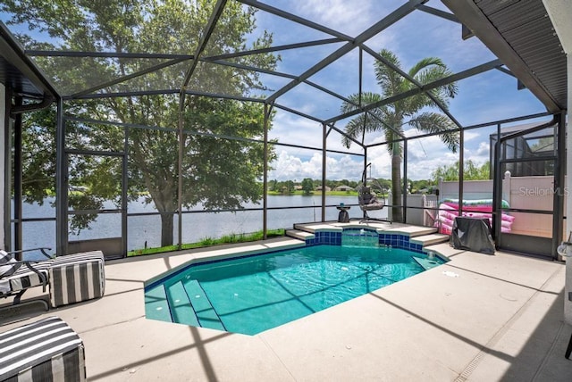 533 Quail Down Dr, Debary, FL 32713 - view of swimming pool featuring a patio area, a water view, a lanai, and a pool with connected hot tub