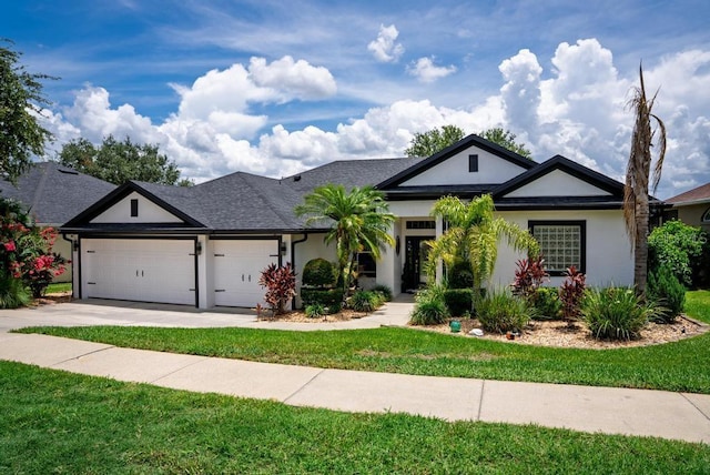 533 Quail Down Dr, Debary, FL 32713 - ranch-style house featuring stucco siding, an attached garage, concrete driveway, and a front lawn