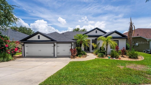 533 Quail Down Dr, Debary, FL 32713 - single story home with a garage, concrete driveway, a front yard, and stucco siding
