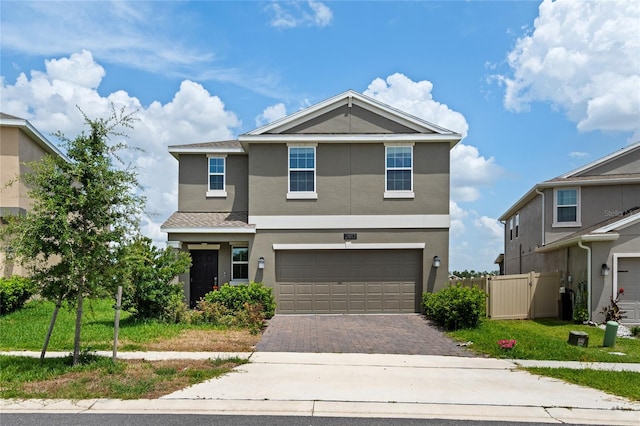 2817 Muller Oak Loop, Ocoee, FL 34761 - view of front of home featuring stucco siding, decorative driveway, and a garage