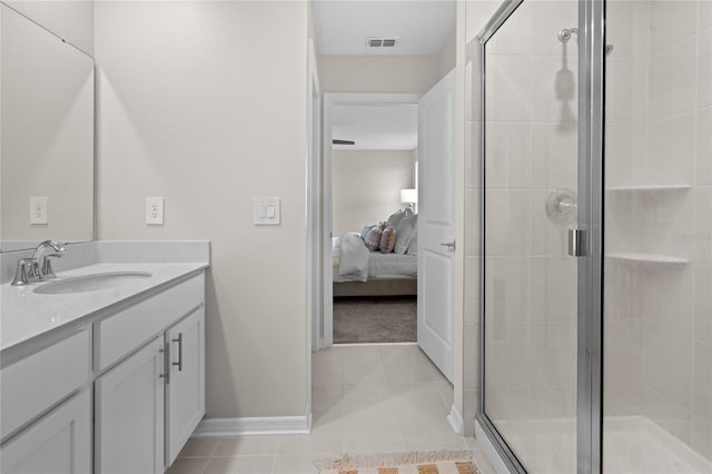 2817 Muller Oak Loop, Ocoee, FL 34761 - ensuite bathroom featuring vanity, a stall shower, and tile patterned flooring