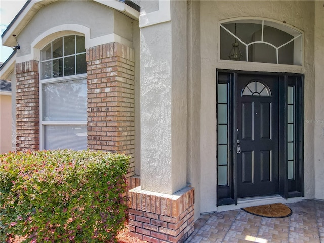 12938 Maribou Cir, Orlando, FL 32828 - property entrance featuring stucco siding and brick siding