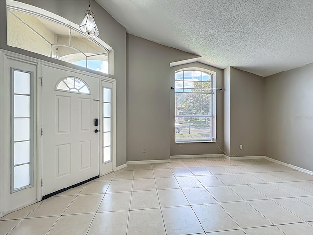 12938 Maribou Cir, Orlando, FL 32828 - entryway with a textured ceiling and light tile patterned floors