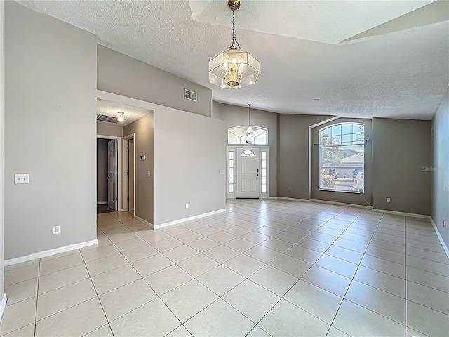 12938 Maribou Cir, Orlando, FL 32828 - spare room with a textured ceiling and light tile patterned flooring