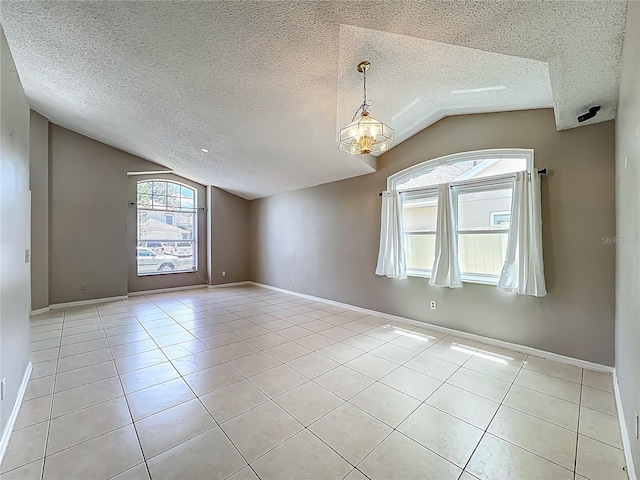 12938 Maribou Cir, Orlando, FL 32828 - tiled empty room with lofted ceiling and a textured ceiling