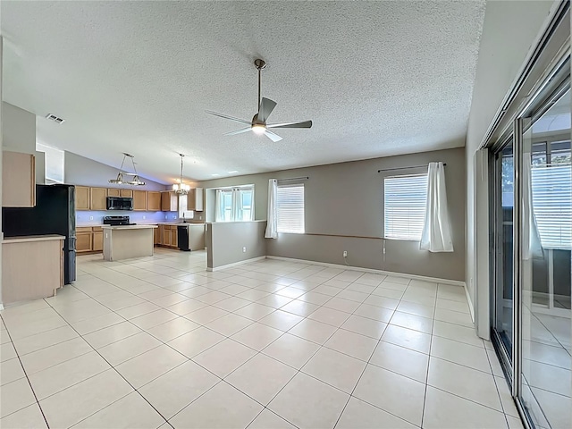 12938 Maribou Cir, Orlando, FL 32828 - unfurnished living room featuring a ceiling fan, a textured ceiling, lofted ceiling, light tile patterned floors, and a chandelier