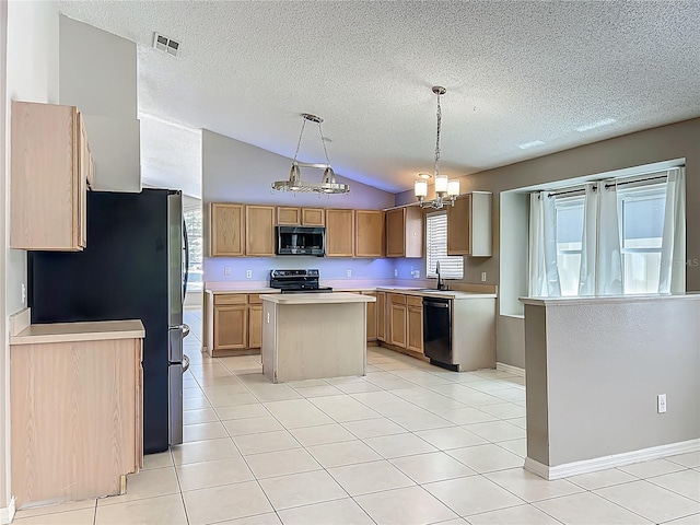 12938 Maribou Cir, Orlando, FL 32828 - kitchen with black appliances, lofted ceiling, a center island, light countertops, and a chandelier