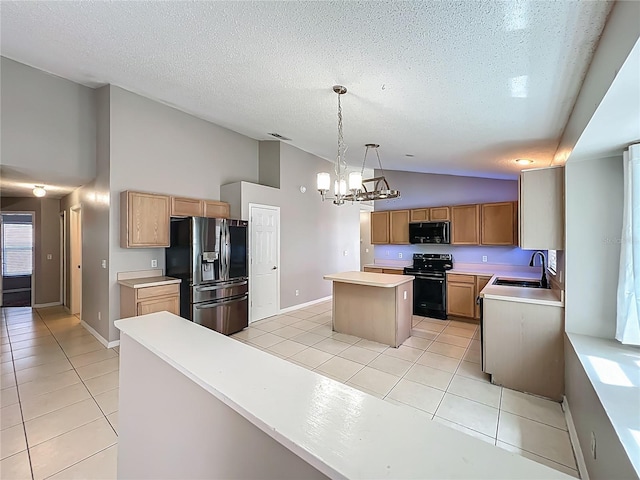 12938 Maribou Cir, Orlando, FL 32828 - kitchen with black appliances, a center island, light tile patterned floors, a chandelier, and light countertops