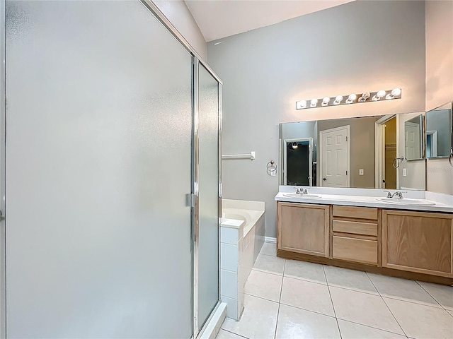 12938 Maribou Cir, Orlando, FL 32828 - full bathroom with a stall shower, a garden tub, double vanity, and tile patterned flooring