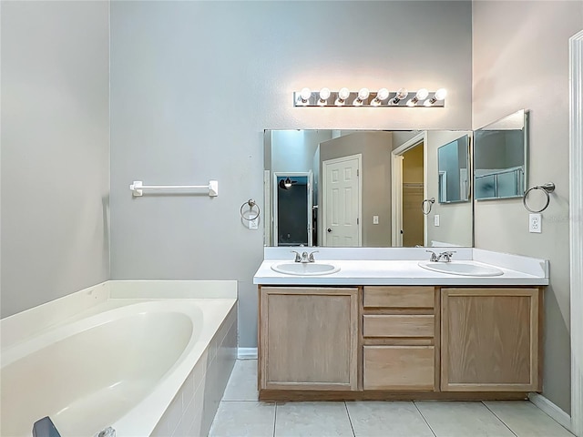 12938 Maribou Cir, Orlando, FL 32828 - bathroom featuring a bath, tile patterned flooring, and double vanity