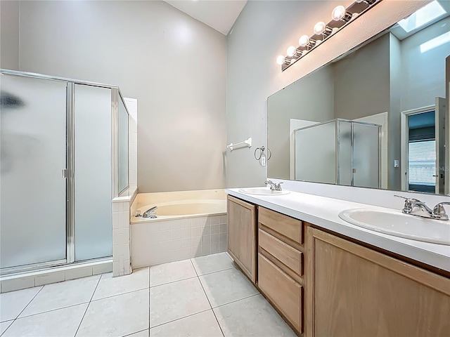 12938 Maribou Cir, Orlando, FL 32828 - full bath with a shower stall, double vanity, a bath, and tile patterned flooring