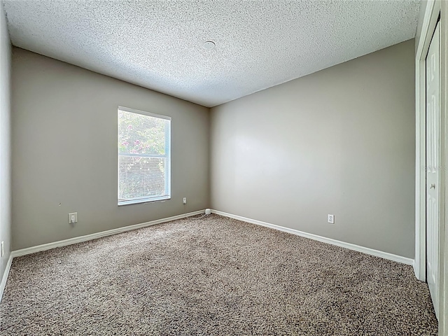 12938 Maribou Cir, Orlando, FL 32828 - carpeted spare room with a textured ceiling