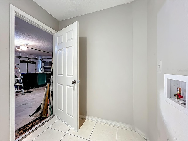 12938 Maribou Cir, Orlando, FL 32828 - hallway featuring a textured ceiling and tile patterned flooring