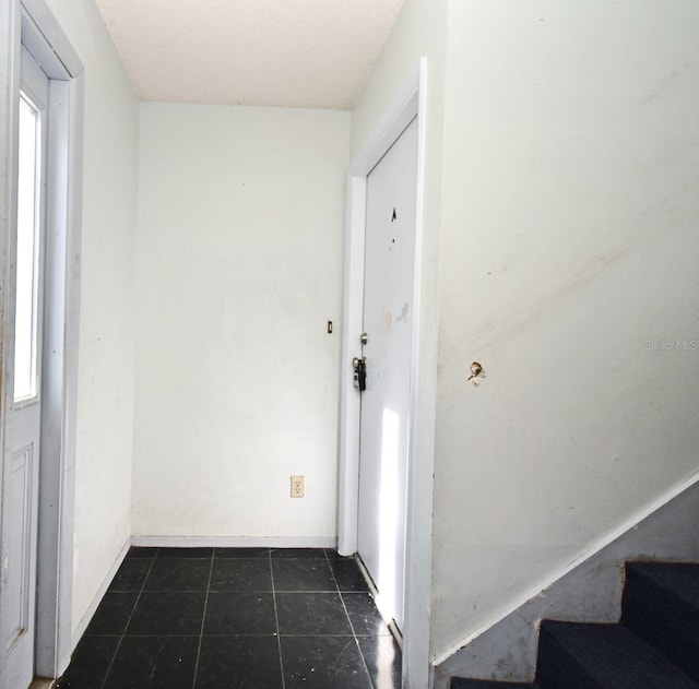 3057 Aaron Burr Ave Unit 1, Winter Park, FL 32792 - entryway with dark tile patterned floors and stairs